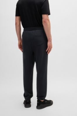 BOSS Relaxedfit tracksuit bottoms with tonal artwork