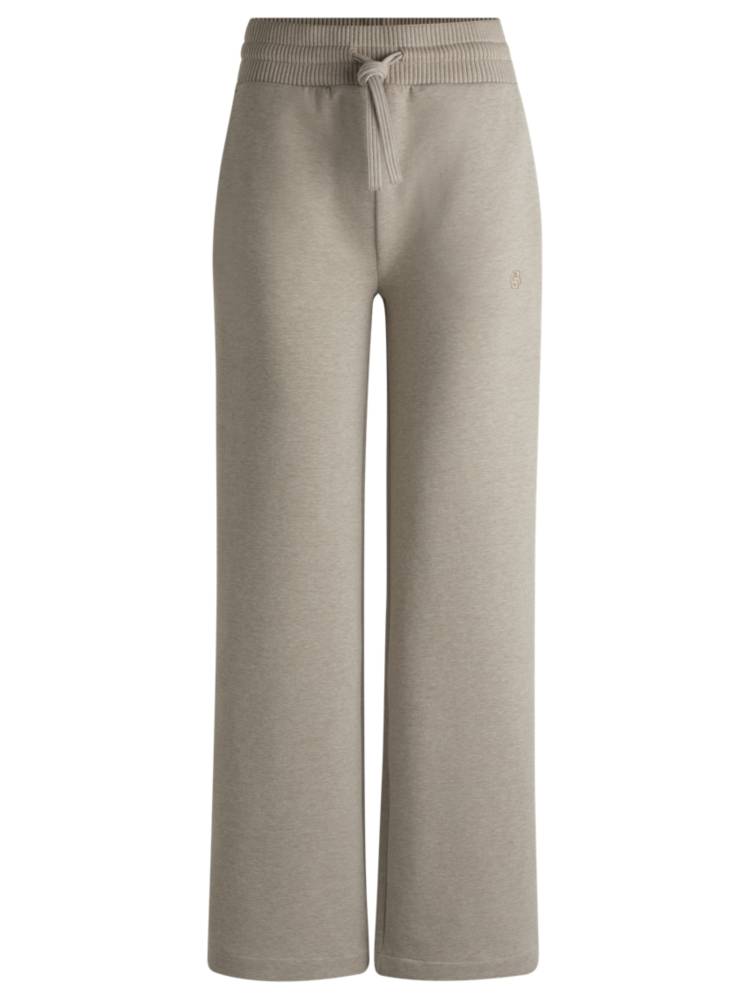 Artikel klicken und genauer betrachten! - Elegante BOSS Jogginghose. Die Hose aus meliertem Baumwoll-Jersey mit gerippten Bündchen aus Stretch-Baumwolle ist mit einem Double-B-Monogramm versehen. | im Online Shop kaufen