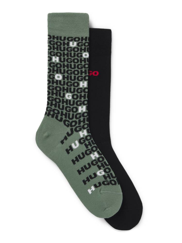 Artikel klicken und genauer betrachten! - Zwei Paar HUGO Socken mit Logo-Details. Die mittelhohen Socken sind aus einem elastischen Gewebe gefertigt. Dieses Produkt wird teilweise aus Bio-Baumwolle gefertigt. Unsere Bio-Standards erlauben keine Verwendung von synthetischen Düngemitteln, Pestiziden oder gentechnisch verändertem Saatgut. | im Online Shop kaufen