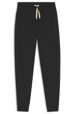 Tracksuitbyxor med muddar och dragsko i v&aring;ra f&auml;rger, Svart