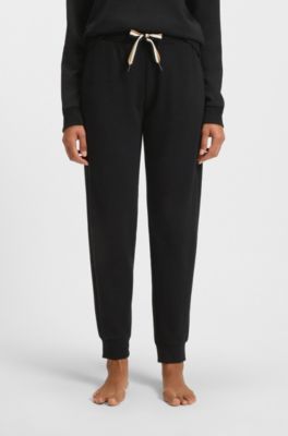 Tracksuitbyxor med muddar och dragsko i v&aring;ra f&auml;rger, Svart