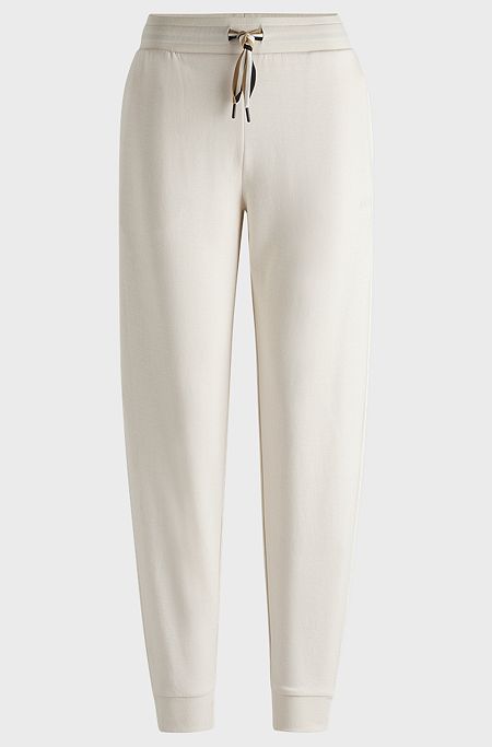 Cuffed tracksuit bottoms with signature-stripe drawcord, White