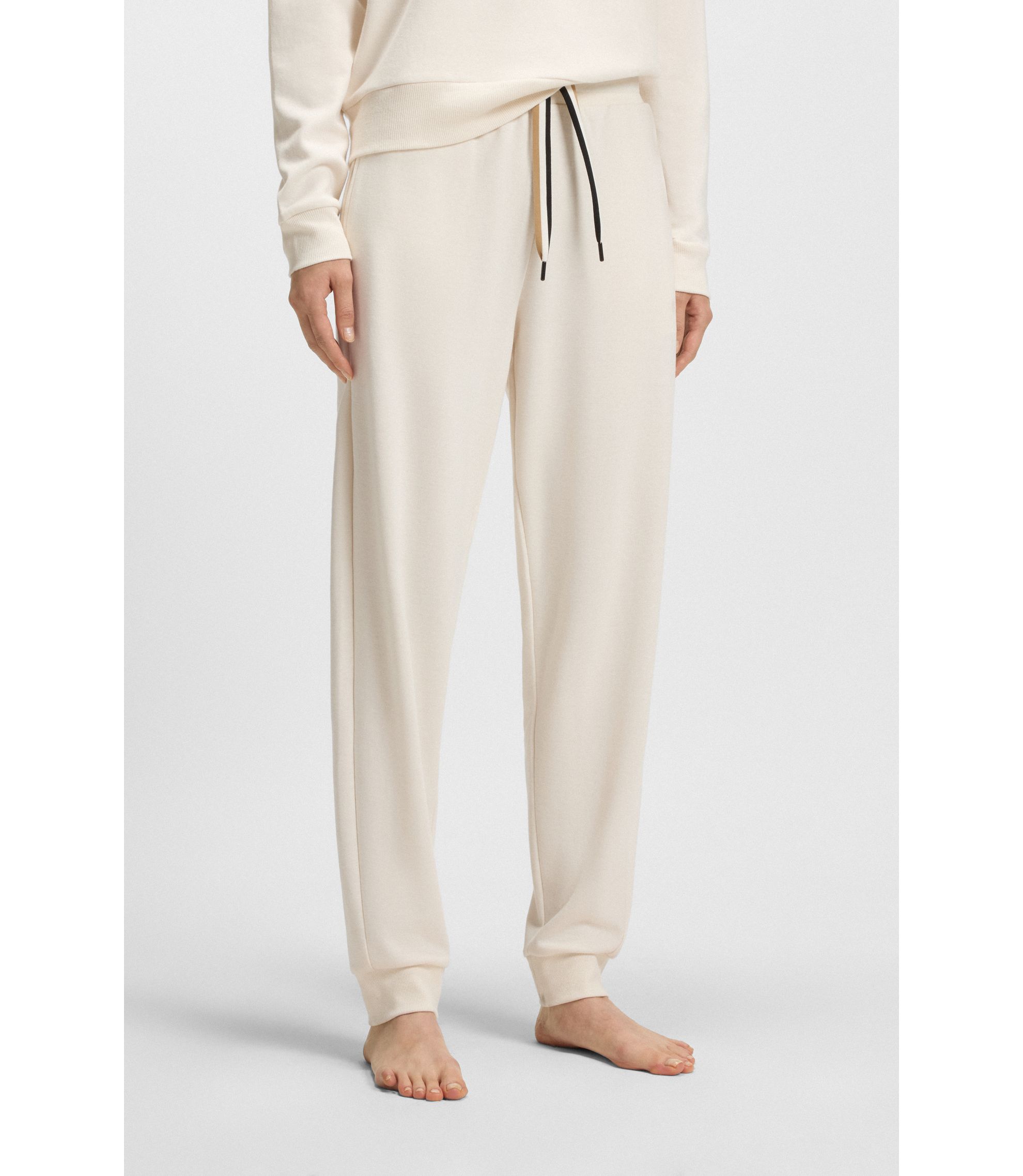 Jogginghose mit Beinbündchen und Signature-Streifen an den Kordeln