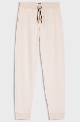 Cuffed tracksuit bottoms with signature-stripe cords, light pink