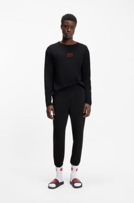 Cuffed loungewear bottoms in stretch cotton with logo print, Black