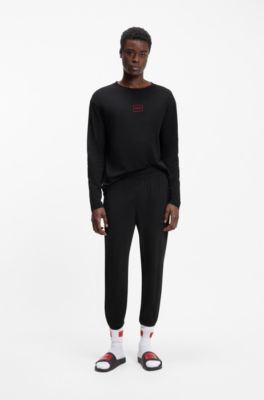 Pantaloni da casa in cotone elasticizzato con polsini alle caviglie e logo stampato, Nero