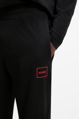 Cuffed loungewear bottoms in stretch cotton with logo print, Black