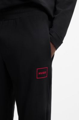 Cuffed loungewear bottoms in stretch cotton with logo print, Black
