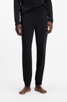 Cuffed loungewear bottoms in stretch cotton with logo print, Black
