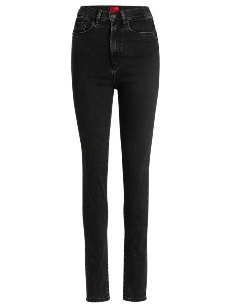 Artikel klicken und genauer betrachten! - Eng anliegende HUGO Jeans. Die Hose mit hohem Bund ist aus Super-Stretch-Denim in einem vielseitig kombinierbaren Schwarz gefertigt und mit Used-Details versehen. | im Online Shop kaufen