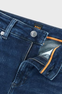 Blue jeans in distressed stretch denim with frayed hems, Dark Blue