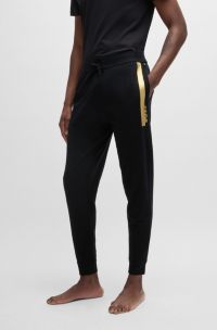 Cotton-terry tracksuit bottoms with metallic logo, Black