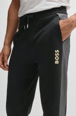 BOSS - Cotton-blend tracksuit bottoms with foil-print logo - Black