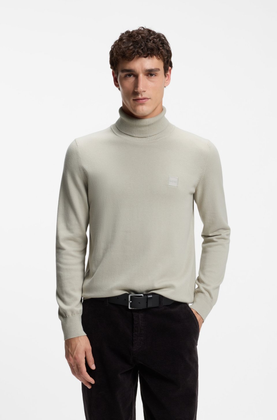 Rollneck sweater in cotton and cashmere with logo patch