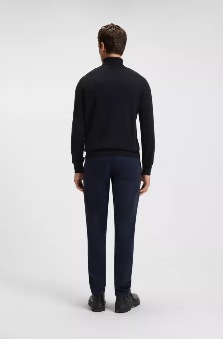 Rollneck sweater in cotton and cashmere with logo patch