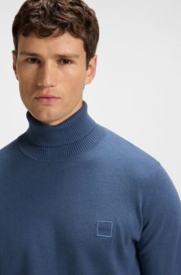 Rollneck sweater in cotton and cashmere with logo patch, Blue