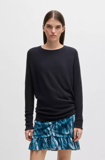 Relaxed-fit sweater with rolled edges and logo charm