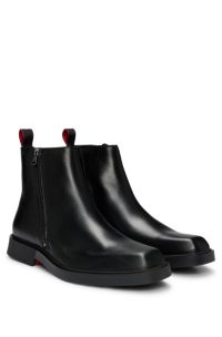 Bottines zippées en cuir avec semelle extérieure emblématique, Noir