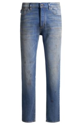 Jeans con fit affusolato in denim blu con effetto fango, Blu