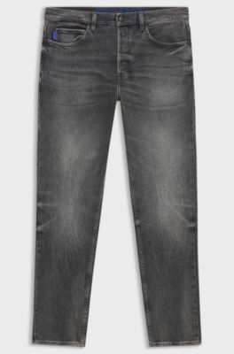 Jeans tapered fit de denim el&aacute;stico gris oscuro, Gris