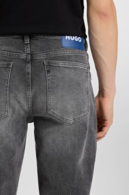 Jeans tapered fit de denim el&aacute;stico gris oscuro, Gris
