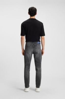 Jeans tapered fit de denim el&aacute;stico gris oscuro, Gris