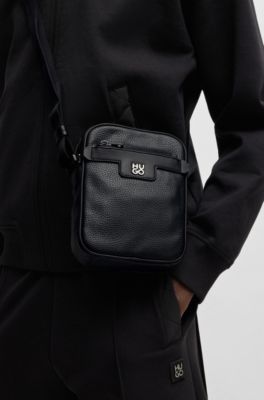 Grained faux-leather reporter bag with stacked-logo trim, Black