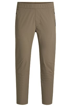 Pantalones con pernera cónica en tejido elástico repelente al agua