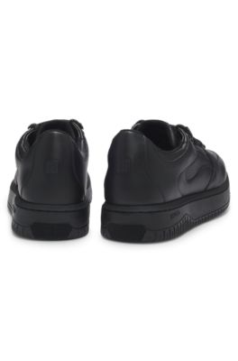 Lace-up trainers in tumbled leather, Black