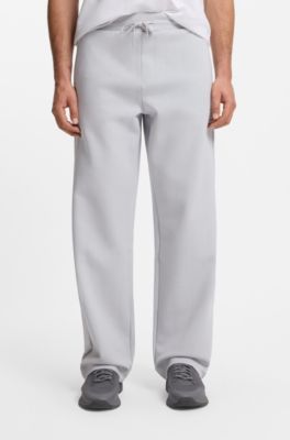 Tracksuit bottoms in a drop-needle cotton blend, Light Grey