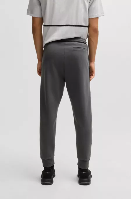 Cotton-blend tracksuit bottoms with tape and logo