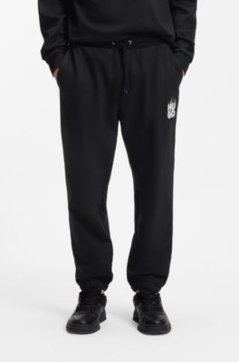 Cotton-terry tracksuit bottoms with smoke logo, Black