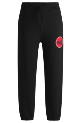 Cotton-terry tracksuit bottoms with logo print, Black
