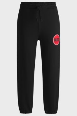 Cotton-terry tracksuit bottoms with logo print, Black