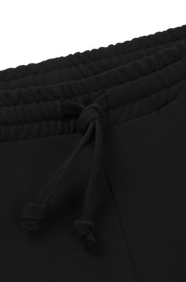 Cotton-terry tracksuit bottoms with logo print, Black