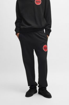 Cotton-terry tracksuit bottoms with logo print, Black