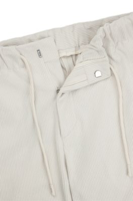 Tapered-fit trousers in performance corduroy, White
