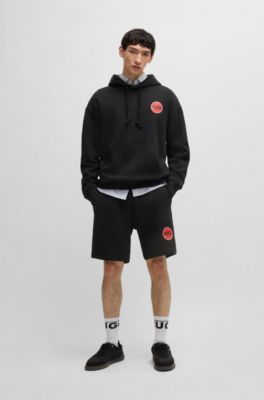 Cotton-terry relaxed-fit shorts with logo print, Black