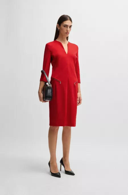V-neck dress with zipped pockets and cropped sleeves