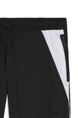 Loose-fit tracksuit bottoms with Happy HUGO logo, Black