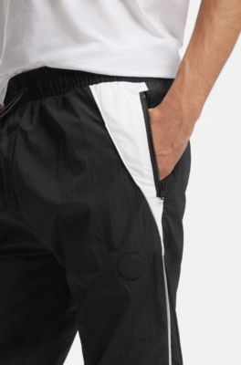 Loose-fit tracksuit bottoms with Happy HUGO logo, Black