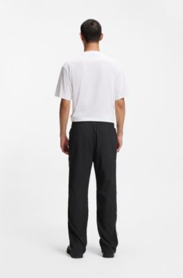 Loose-fit tracksuit bottoms with Happy HUGO logo, Black