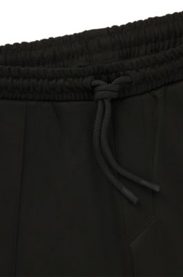 Faux-suede tracksuit bottoms with logo badge, Black