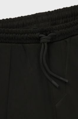 Faux-suede tracksuit bottoms with logo badge, Black