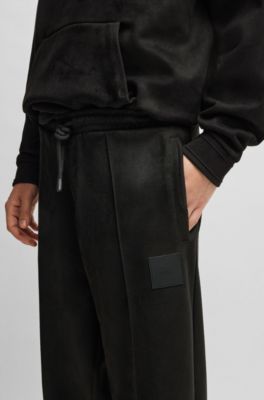 Faux-suede tracksuit bottoms with logo badge, Black