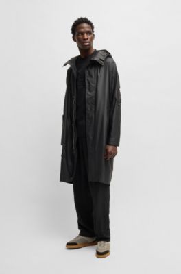 Hooded raincoat with concealed closure, Black
