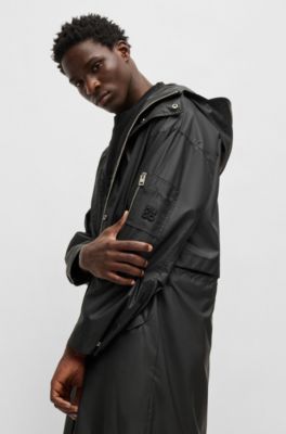 Hooded raincoat with concealed closure, Black