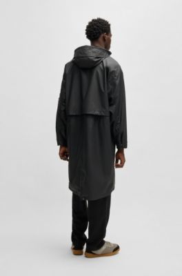 Hooded raincoat with concealed closure, Black