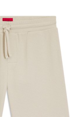 Pyjamasshorts med v&aring;ffelstruktur och broderad logga, Ljusbeige