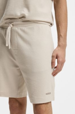 Pyjamasshorts med v&aring;ffelstruktur och broderad logga, Ljusbeige